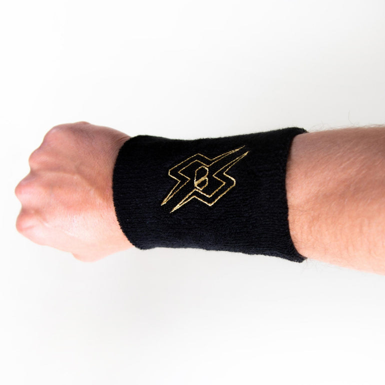 Blindsave Svettband R/C “X” Black/Gold, Svart svettband med guld detaljer från Blindsave, bild med svettbandet på armen